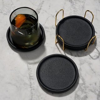 MODERN COASTERS WITH GOLD STAND - Crafted from beautiful glazed earthenware, these drink coasters with holder complement any decor style and give your home a rich textured aesthetic. The gold stand adds a touch of glam.