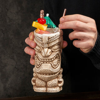 BOLD TIKI FACE DESIGN IN HAND PAINTED CERAMIC – Strong lines with deep angles in these tiki glasses create an eye-catching tiki face. Made from sturdy ceramic, these tiki mugs are hand painted with special details for your favorite tiki drinks.