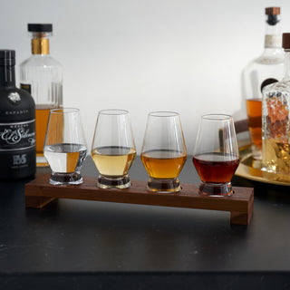 ACACIA WOOD COMPLEMENTS LIQUOR- Four 8 oz. tasting glasses nest in a beautiful wooden tray. The sleek design keeps your single malt Scotch or brandy safely in place, while the platform beneath the board makes it easy to pick up and set down.
