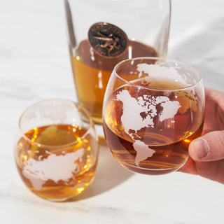 EXQUISITE GLOBE GLASSES ETCHED WITH CONTINENTS OF THE WORLD - The beautiful frosted effect on these globe whiskey glasses creates a striking design, while also being subtle enough to show off the beautiful hue and glow of the whiskey within them.
