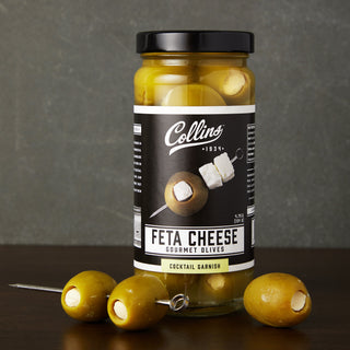 FETA CHEESE OLIVES – Discover a gourmet jar of hand-packed Greek olives. Bold and tangy, these olives are perfect for adding a Mediterranean vibe to any cocktail or salad.
