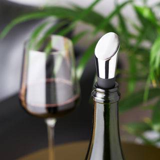 STAINLESS STEEL AND SILICONE - Crafted from stainless steel with an inner silicone seal, this weighted wine stopper adds class to your barware collection. It easily fits standard wine bottles and many liquor bottles and specialty beer bottles.