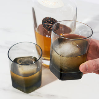 SMOKEY LEAD-FREE CRYSTAL – Celebrate with your favorite bourbon, rum, or rye with these versatile tumblers. Splitting off from a sturdy base, the geometric design and clean lines create a glassware set with modern flair.