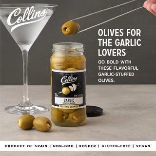GARLIC QUEEN OLIVES – Discover a gourmet jar of hand-packed Greek olives. Bold and salty, these garlic-stuffed olives are perfect for those who want to take their cocktails to the next level.
