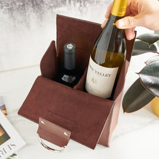 STURDY CONSTRUCTION AND STAINLESS STEEL HANDLES - The elegant, rich brown of leather is complemented by two polished stainless steel rings that serve as handles, while the snap closure helps keep your bottle secure.