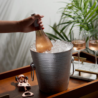 ELEVATE YOUR DRINK SERVICE - Bring professional panache to your next dinner party by keeping your champagne cold in this stunning ice bucket. The hammered finish subtly glints in the light, highlighting your fine wines and adding elegance to your table.