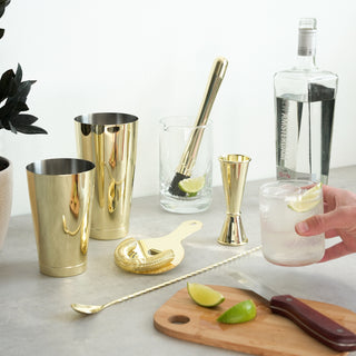 GOLD-PLATED 7-PIECE BAR MIXING SET - This set includes: Crystal Mixing Glass, Hawthorne Strainer, Bar spoon, Large Boston shaker tin, Small Boston shaker tin, Muddler and Makoto jigger. Truly everything you need for your favorite cocktail recipes.
