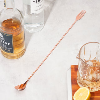 BAR MIXING SPOON WITH TRIDENT TIPPED END - The fork tipped end of our bar spoons make it easier for you to spear the perfect garnish to cap your cocktails. Cocktail stirring spoons will elevate your home bartending with panache.