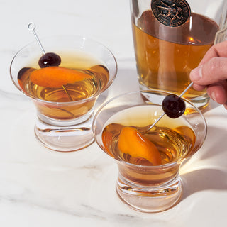 AN ICONIC GLASS, RE-IMAGINED - The sleek, space-age curves and heavy base of this stemless cocktail coupe give your favorite drink a little ‘60s grandeur. The flared rim enhances the aroma of your drink and gives this glass a fresh feel.