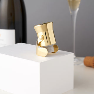 STAINLESS STEEL AND POLISHED GOLD - Crafted from stainless steel with inner silicone seal, this gold plated wine stopper adds class to your barware collection. It easily fits standard, champagne and specialty beer bottles.