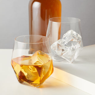 SPARKLING LEAD-FREE CRYSTAL –A heavy bottom gives these glasses weight, while the clean lines create contemporary flair. Splitting off from a triangular base, nine cuts of crystal capture light to illuminate the liquor inside this multi-faceted tumbler.
