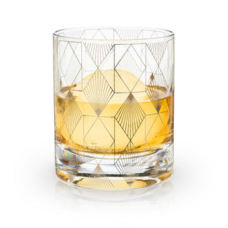 ART DECO-INSPIRED CRYSTAL GLASSWARE– This beautiful cocktail glass draws on the decadence and modernity of the 1920s. This gilded tumbler draped in Art Deco motifs looks great on a bar cart, but truly shines with a prohibition-era cocktail.
