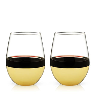 STRIKING WINE GLASS SET - Ditch the boring glassware and stand out from the crowd with these eye-catching stemless wine cups. Partially dipped in sparkling polished gold, these clear cocktail glasses show off your beverage with refined glamour. 