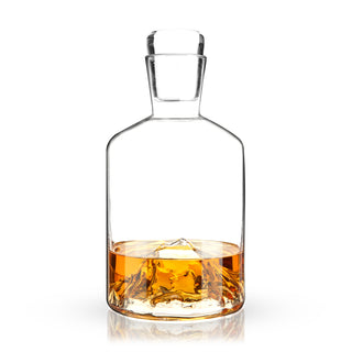 MOUNTAIN CRYSTAL DECANTER – Clear, smooth walls show off the majestic mountain peak nestled at the bottom of this unique decanter. Eye-catching and useful, this dimensional decanter set pays homage to the mountains of the Pacific Northwest.
