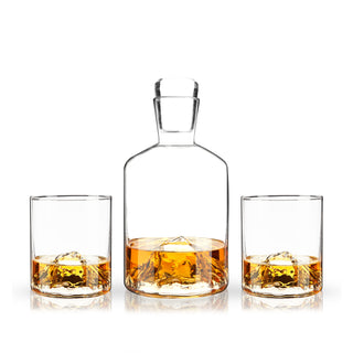 MOUNTAIN CRYSTAL WHISKEY GLASSWARE – Clear, smooth walls show off the majestic mountain peaks nestled at the bottom of these unique tumblers and crystal decanter set. The decanter holds 24 oz. and tumblers 9 oz. of your favorite Scotch or gin.