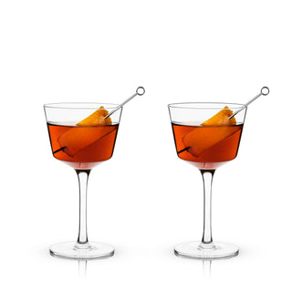 COUPE GLASSES FOR CONNOISSEURS - This classic cocktail glass makes a refined addition to an at-home bar set or kitchen. Arguably a barware essential, this set of stemmed coupe cocktail glasses gives your home bar some Old Hollywood panache.