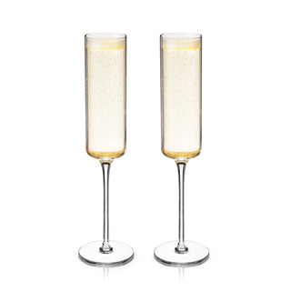 TWO STEMMED CHAMPAGNE FLUTES – This beautiful pair of sparkling wine glasses will enhance your finest vintages. Crafted with sparkling wines like Champagne or Prosecco in mind, this gorgeous glassware is also perfect for Champagne cocktails.